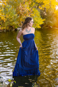 Denver senior portraits of girl in her prom dress in the lake